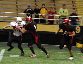 David Sigler blocks for Devin Schmidt who scored the game-ending touchdown on this play, a 36-yard catch and run.