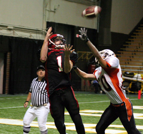 David Sigler is about to catch a long pass for a touchdown.