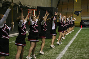 The Prairie cheerleaders count off 22 jumping jacks after Prairie's final touchdown.