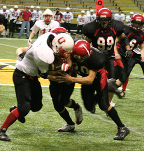 Tyrell Langston and Kyle Daly tackle Oakley's Colten Wadsworth. Kyler Shumway and Branden Waller are in the background.