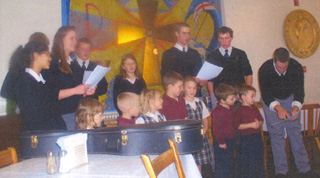 Summit students sing during their Christmas party.