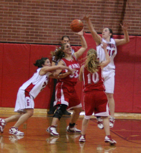 Amber Holthaus and Kaylee Uhlenkott double team a C.V. player.