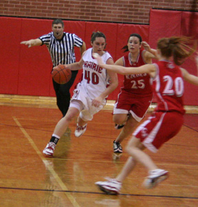 Kaylee Uhlenkott drives toward the hoop against C.V.