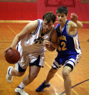 Chase Nuxoll drives toward the hoop. He had 19 rebounds for the Patriots.