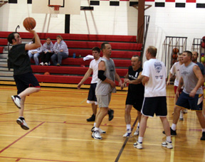 Zack Frei puts up a 1-handed shot. Others from left are Will Schlader, Glenn Poxleitner, Rusty Lorentz, Adam Forsmann, Jared Nau, Pepper Harman and Maurice Seubert.
