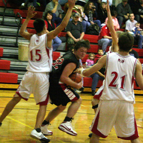 Branden Waller is surrounded by C.V. defenders but managed to get through for a lay-up.