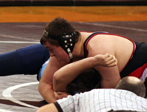 Chance Ratcliff tries to pin a Grangeville opponent in the Pirates home match.