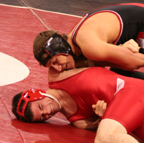 Tyrell Langston has a C.V. wrestling grimacing as he tries to get him into pinning position.