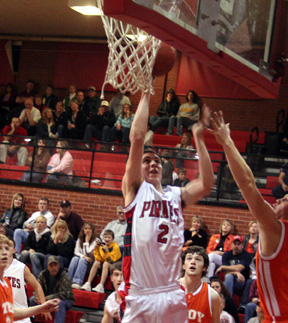 Eric Daly got inside for a layup against Troy.