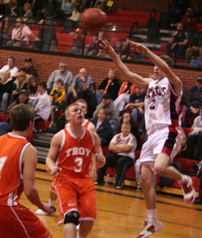 Eric Daly makes a pass in the Troy game.