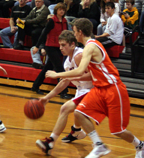 Kyle Daly dribbles past a Troy defender.