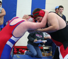 Mitch Jungert grapples with a Pine Eagle (Oregon) wrestler.