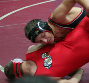Tyrell Langston works over a Clarkston wrestler on his way to a third place medal.
