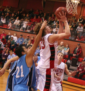 David Sigler scores a lay-up. Kyle Daly is in the background.
