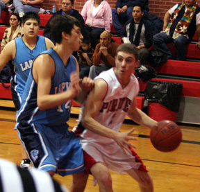Eric Daly looks to get past a Lapwai defender for a layup.