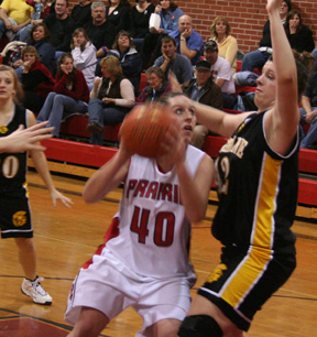 Kaylee Uhlenkott looks to get a shot up past Timberline's 6'2 Lundyn Jared.