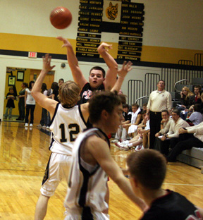 Joe Schumacher passes down to Beau Schlader, who is cutting to the hoop along the baseline.