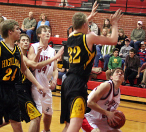 Seth Guyer looks for an opening to put up a shot. Andrew Gabica is at left.