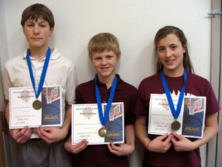 Austin Chmelik, Rhett Schlader and Savannah Kuther, KC hoop shoot winners.