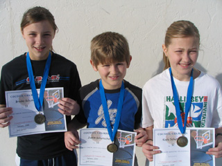 Kayla Schumacher, Justin Schumacher and Brooke Schumacher, KC hoop shoot winners.