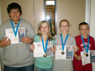 Apolonio Enriquez, Hailey Danly, Kellie  Heitmann and Hunter McWilliams, KC hoop shoot winners.