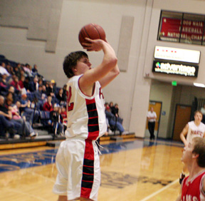 Branden Waller puts up a shot against C.V.
