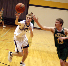 Dylan Prigge and a Culdesac player go after a loose ball.