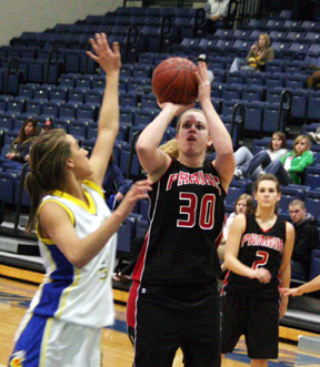 Mary Shears shoots in the Genesee game. Kristi Poxleitner is in the background.