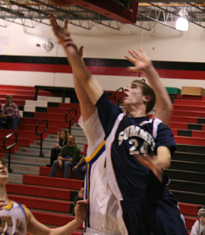 Dylan Prigge scores a lay-up against Clark Fork and it appears he also gets fouled.