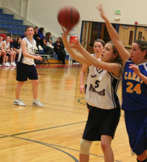 Savannah Kuther puts up a perimeter shot against Carey.