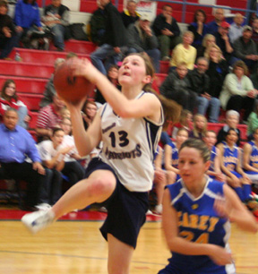 Rachel Wemhoff drives for a lay-up attempt against Carey.