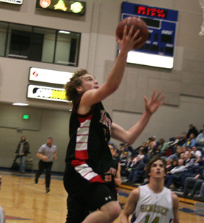 David Sigler scores a layup after making a steal late in the first half.