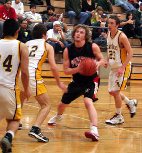 David Sigler is surrounded by Cascade defenders.