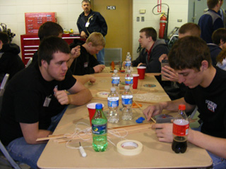 Chance Ratcliff and Eric Daly study their project.
