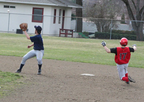 Kyle Holthaus slides into second after a misplay in left field of his single.