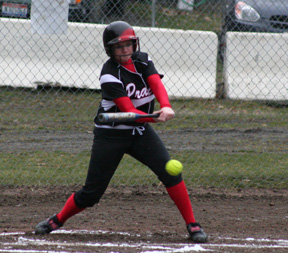 Rachel Kaschmitter takes a swing at a low pitch in the Orofino game.