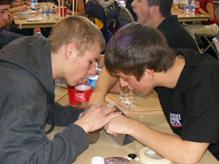 Steven Baerlocher and Kyle Holthaus work together on a project.