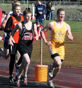 Brock Heath runs 2nd in the 3200 behind Timberline's Austin Blain.