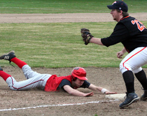 Conner Rieman dives head first into third base with a triple in the 5th inning.