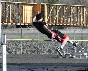 Ryan Dalgliesh clears a height in the high jump.