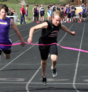 Devin Schmidt won his heat in the 100 meter dash but didn't run in the final due to a troublesome knee.