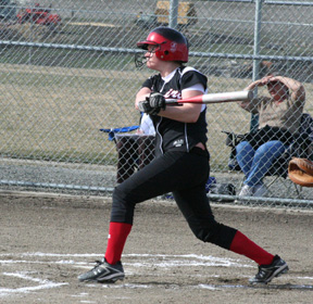 Kara Guyer pounds the ball deep into the outfield.