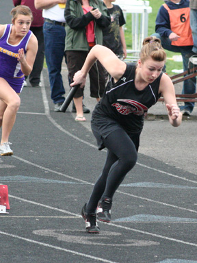 Kristin Hill gets out of the blocks to lead off the 4x100 relay. The same group of girls as in the above photo also finished third in this event.
