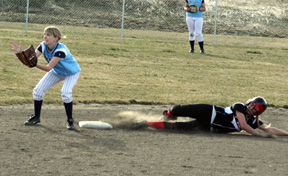 Leora Laurino slides into second with one of her 5 hits in the Grangeville game.