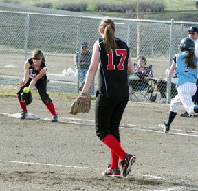 Megan Sigler catches a toss from pitcher Sammi Frei to put out a Grangeville runner at first.