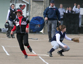 Amber Holthaus beats the ball to first in the first Genesee game.