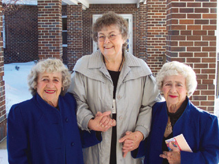 Sister Corinne Forsman, Mission and Pastoral Care Director, St. Mary's Hospital, Cottonwood, escorts identical twins Dorothy Kelly (left) and Bernie Tipton as they go for flu shots, 2008.