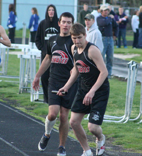 Joe Poxleitner hands off to Kevin Karel in the 4x400 relay.
