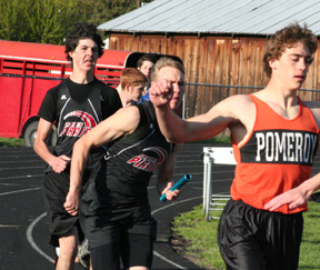 Ryan Dalgliesh hands off to anchorman Devin Schmidt in the 4x100 relay. Devin took the baton in third and got within a foot of winning the race.