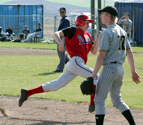 Eric Daly rounds third on his way to scoring a run against Timberline.